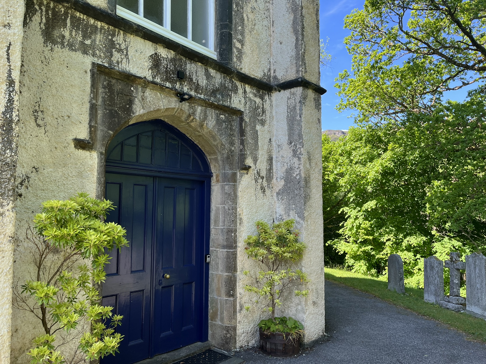 The entrance to Glenorchy Parish Church, an arched doorway at the foot of the tower.