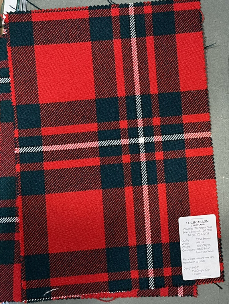 Woven MacGregor tartan swatch in bright red and dark green with white lines.